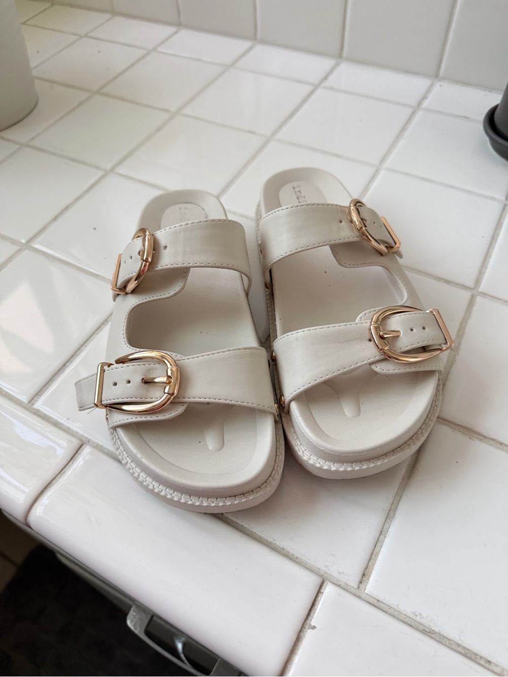 Indigo Women’s Cream Slide Sandals with Gold Buckles